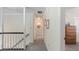 Upstairs hallway featuring white walls, trim, carpet and staircase with a black banister at 5679 Brookstone Nw Walk, Acworth, GA 30101