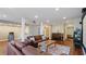 Living room features a projector, comfortable sofas, hardwood floors, and a piano at 5679 Brookstone Nw Walk, Acworth, GA 30101