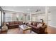 Relaxing living room with leather sofas, a stylish rug, and natural light at 5679 Brookstone Nw Walk, Acworth, GA 30101