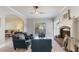 Elegant living room with a cozy fireplace, and comfortable seating with ample natural light at 5679 Brookstone Nw Walk, Acworth, GA 30101