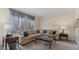 Inviting living room with a large window, comfortable sectional sofa, and stylish decor at 5679 Brookstone Nw Walk, Acworth, GA 30101