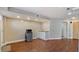 Living room with wet bar, a mini-fridge, wooden flooring, and neutral-colored walls at 5679 Brookstone Nw Walk, Acworth, GA 30101