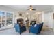 Stylish living room with ample seating, a cozy fireplace, and a ceiling fan for comfortable living at 5679 Brookstone Nw Walk, Acworth, GA 30101