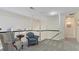 Upstairs loft featuring white walls, trim, carpet and staircase with a black banister at 5679 Brookstone Nw Walk, Acworth, GA 30101