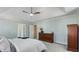 Spacious main bedroom features tray ceiling, ceiling fan, carpet, and windows with blinds at 5679 Brookstone Nw Walk, Acworth, GA 30101