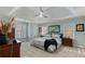 Spacious main bedroom features tray ceiling, ceiling fan, carpet, and windows with blinds at 5679 Brookstone Nw Walk, Acworth, GA 30101