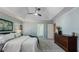 Spacious main bedroom features tray ceiling, ceiling fan, carpet, and windows with blinds at 5679 Brookstone Nw Walk, Acworth, GA 30101