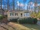 Charming home featuring stone accents, manicured greenery, and a cozy front porch at 1184 Broward Ne Dr, Marietta, GA 30066