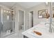 Bright bathroom with glass shower, dual-sink vanity, and neutral color palette at 201 Lytham Se Dr, Mableton, GA 30126