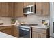Modern kitchen with quartz countertop, stainless steel appliances, and stylish tiled backsplash at 201 Lytham Se Dr, Mableton, GA 30126