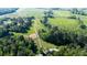 Aerial view of long driveway through wooded property to country home at 291 Folsom Glade Rd, Rydal, GA 30171