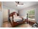 Bedroom with a four-poster bed, neutral walls, and wood-look floors at 291 Folsom Glade Rd, Rydal, GA 30171