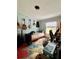 Cozy bedroom with natural light, featuring a colorful rug, musical instruments, and desk at 291 Folsom Glade Rd, Rydal, GA 30171