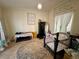 Bedroom area with a crib, accent furniture, and a decorative rug, creating a warm, inviting space at 291 Folsom Glade Rd, Rydal, GA 30171