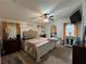 Main bedroom featuring a comfortable bed, ceiling fan, decorative lighting, and bright windows at 291 Folsom Glade Rd, Rydal, GA 30171