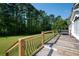 Relaxing deck area with stylish railing, a swing, and serene backyard views, perfect for outdoor living at 291 Folsom Glade Rd, Rydal, GA 30171
