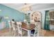 Dining room features a wooden table, bright light fixture, and neutral color scheme at 291 Folsom Glade Rd, Rydal, GA 30171