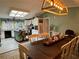 Open-concept with a kitchen and dining area featuring a large table, decorative lighting, and bright accents at 291 Folsom Glade Rd, Rydal, GA 30171