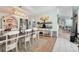 Charming dining room with rustic table, decor, open floorplan, and modern light fixture creates a warm gathering space at 291 Folsom Glade Rd, Rydal, GA 30171