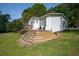 Charming home featuring a spacious wooden deck and landscaped yard, nestled in a serene setting at 291 Folsom Glade Rd, Rydal, GA 30171