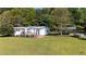 Charming single-story home with a wooden deck and a covered parking area on a large lot at 291 Folsom Glade Rd, Rydal, GA 30171