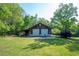 A two-car garage with an attached shed on a green lawn at 291 Folsom Glade Rd, Rydal, GA 30171