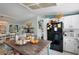 Bright kitchen with island, modern appliances, and eat-in dining area enhances the home's appeal for cooking and gatherings at 291 Folsom Glade Rd, Rydal, GA 30171