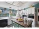 Bright kitchen with white cabinets, subway tile backsplash, and large window bringing in natural light at 291 Folsom Glade Rd, Rydal, GA 30171