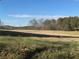 Vast, open field with clear sky and distant treeline at 291 Folsom Glade Rd, Rydal, GA 30171