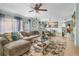 Inviting living room with large sectional sofa, natural light, and open access to other living spaces at 291 Folsom Glade Rd, Rydal, GA 30171