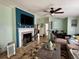 Comfortable living room featuring a decorative fireplace, ceiling fan, and a cozy seating area at 291 Folsom Glade Rd, Rydal, GA 30171
