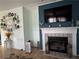 Comfortable living room features fireplace, TV, and custom decorations at 291 Folsom Glade Rd, Rydal, GA 30171