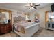 Comfortable main bedroom featuring a cozy quilt, ceiling fan, and natural light creating a relaxing retreat at 291 Folsom Glade Rd, Rydal, GA 30171