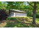 Large outbuilding with metal roof, siding, and level grassy area. Ideal for shop or storage at 291 Folsom Glade Rd, Rydal, GA 30171