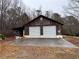 Image of a barn with two garage doors, a concrete pad, and exterior electrical connections at 291 Folsom Glade Rd, Rydal, GA 30171