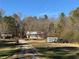 Property features several outbuildings, offering ample storage and workspace in a private setting at 291 Folsom Glade Rd, Rydal, GA 30171