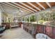 Covered porch offers a cool spot with wood ceiling, fan, bench, and chairs at 291 Folsom Glade Rd, Rydal, GA 30171