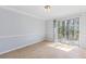 Empty dining room showcasing herringbone floors and sliding glass doors at 3187 Abbeywood Dr, Decatur, GA 30034