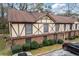 Charming Tudor-style townhome featuring a brick base and decorative timber framing at 3187 Abbeywood Dr, Decatur, GA 30034