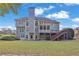 Expansive backyard featuring a deck with stairs, and a screened-in porch at 345 Oakwind Pt, Acworth, GA 30101