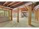 Unfinished basement with exposed beams and ductwork, and a door to the outside at 345 Oakwind Pt, Acworth, GA 30101