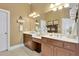 A bathroom featuring double vanities and a large mirror at 345 Oakwind Pt, Acworth, GA 30101