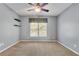 Bedroom featuring neutral walls, carpet flooring and a ceiling fan for comfortable living at 345 Oakwind Pt, Acworth, GA 30101