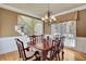 Dining room features hardwood floors, staircase and a large window at 345 Oakwind Pt, Acworth, GA 30101