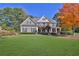 Charming two-story home featuring a well-manicured lawn and mature landscaping at 345 Oakwind Pt, Acworth, GA 30101