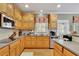 Kitchen area with stainless steel appliances, countertops, hardwood floors and wooden cabinetry at 345 Oakwind Pt, Acworth, GA 30101