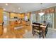 Spacious kitchen and dining area features hardwood floors, wooden cabinets, stainless steel appliances and a center island at 345 Oakwind Pt, Acworth, GA 30101