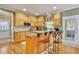 Eat-in kitchen features a breakfast bar and wood cabinetry at 345 Oakwind Pt, Acworth, GA 30101