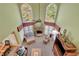 Elegant living room boasting a soaring ceiling, large windows, and cozy fireplace at 345 Oakwind Pt, Acworth, GA 30101