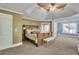 Spacious main bedroom with tray ceiling, plush carpeting and space for a sitting area at 345 Oakwind Pt, Acworth, GA 30101